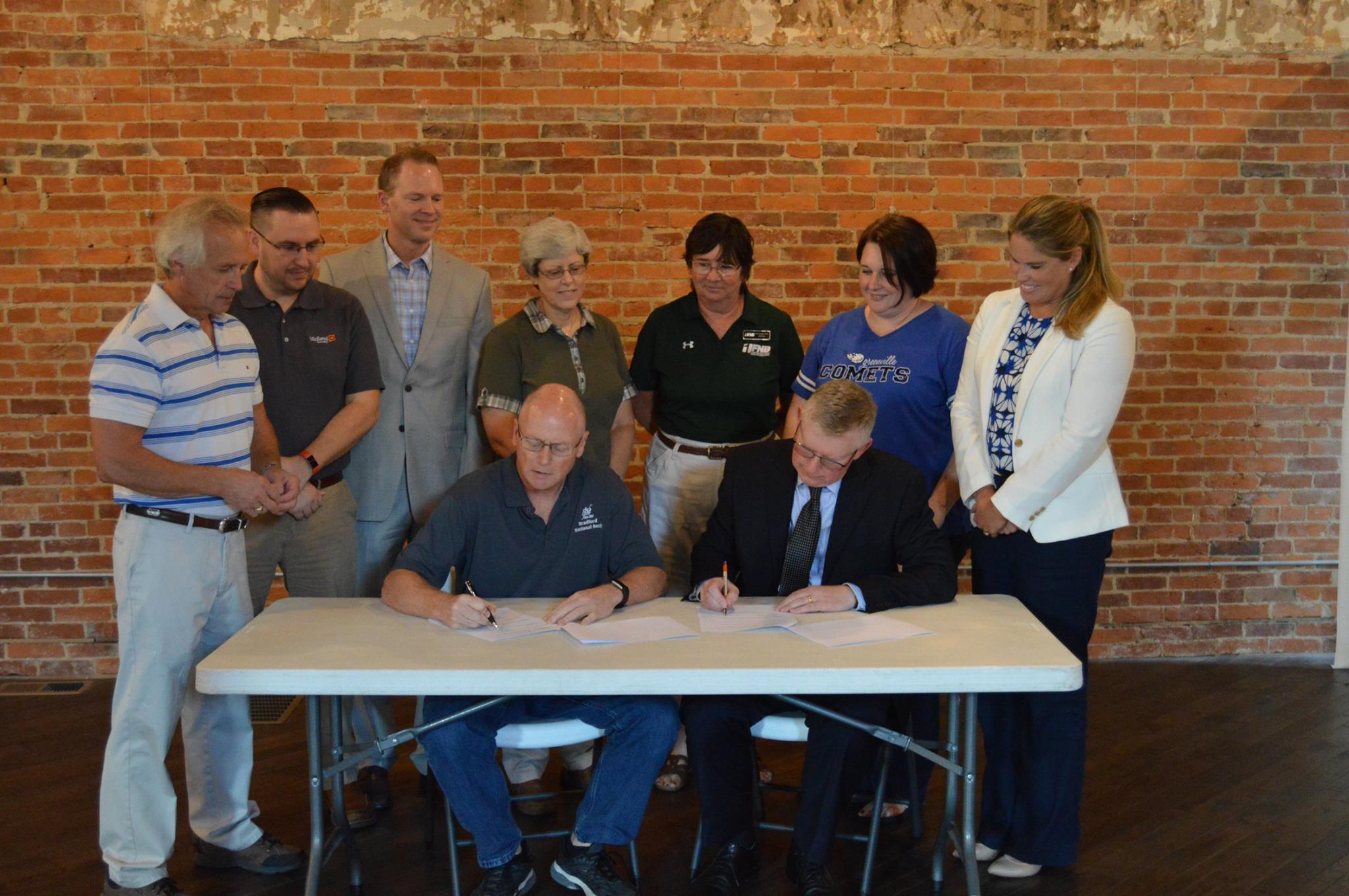 Greenville University and Greenville Chamber of Commerce sign the official agreement creating a position which unifies the resources and connections of both